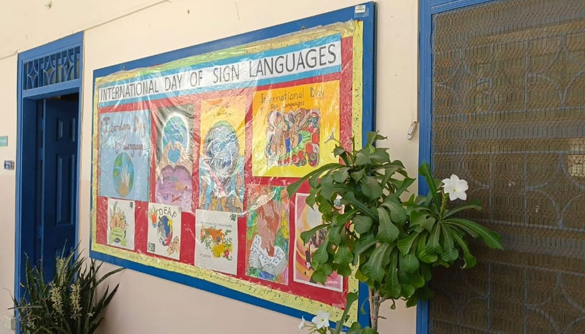 A soft board reading International Day of Sign Languages along with art made by deaf children at Deaf Reach School in Karachi on September 19, 2024. — Photo by author