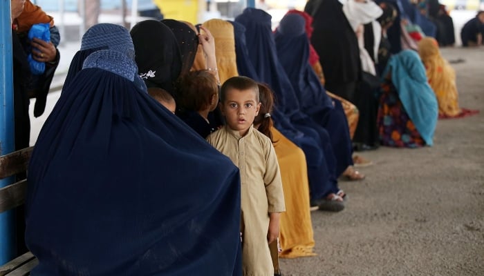 Afghan refugees are registering at UNHCR’s refugee camp and repatriation centre in Nowshera. —INP/ File