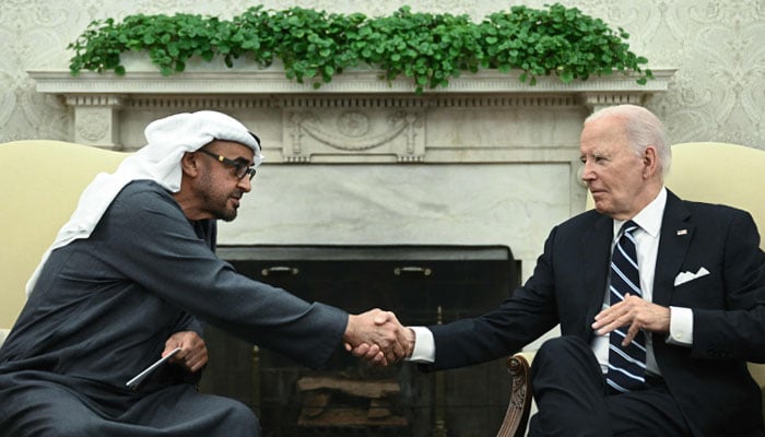 US President Joe Biden shakes hands with President of the United Arab Emirates Sheikh Mohamed bin Zayed Al Nahyan during a meeting in the Oval Office of the White House in Washington, DC, on September 23, 2024. — AFP