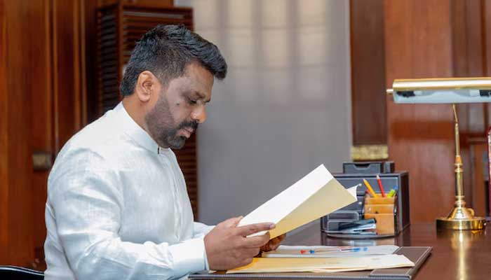 Sri Lankas newly elected President Anura Kumara Dissanayake reads a document after being sworn in as president at the Presidential Secretariat, in Colombo, Sri Lanka, September 23, 2024. — Reuters