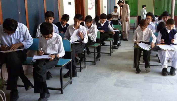 Students sit for an exam at a school in Mingora, Swat Valley. — AFP/File