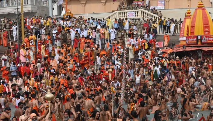 Hindus take a dip in the Ganges river during the Kumbh Mela festival in Haridwar. — AFP