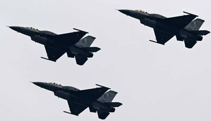 Pakistan Air Force JF-17 fighter jets perform at a rehearsal ahead of Pakistans national day parade in Islamabad on March 21, 2024. — AFP