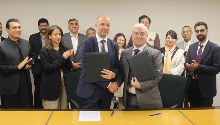 Denmarks Ambassador Jakob Linulf (left) shakes hands with AKF CEO Akhtar Iqbal after signing the SCRIP agreement in Islamabad on September 27, 2024. — PR