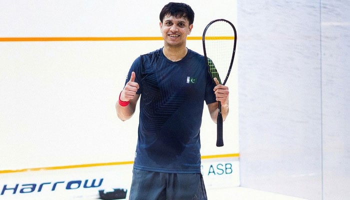 Pakistans squash player Asim Khan poses for a photo during a match. — Reporter/File