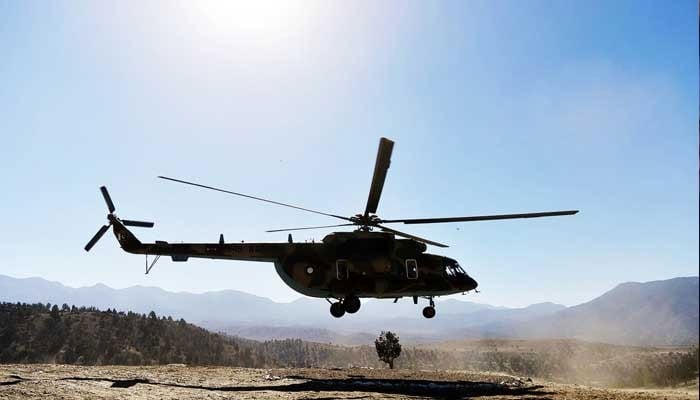 A representational image showing the silhouette of a helicopter during flight. — AFP/File