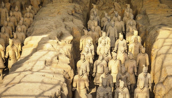 A representational image shows large figures of soldiers at a Chinese tomb. — Unsplash