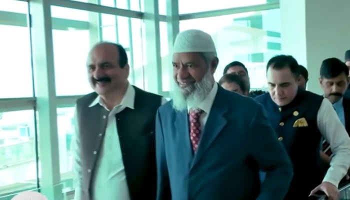 PMs Youth Programme Chairman Rana Mashhood (left) along other government officials is escorting scholar Dr Zakir Naik at the Islamabad airport on September 30, 2024. —Screengrab/ X/ @drzakiranaik