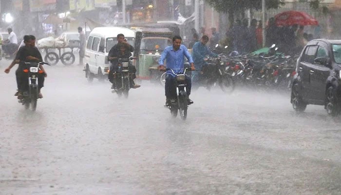 Motorcyclists commuting amid rain in Karachi, on September 20, 2023. — INP