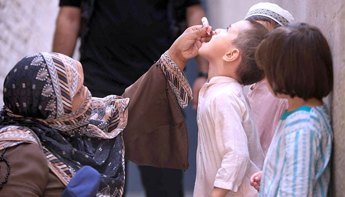 A female health worker administering polio drops to a child during 7-day Pakistan Polio Eradication Programme 2024 in provincial capital on September 9, 2024. — APP