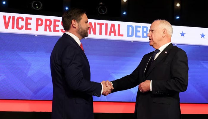 Democratic vice presidential nominee Minnesota Governor Tim Walz and Republican vice presidential nominee US Senator JD Vance (R-OH) shake hands as they attend a debate hosted by CBS in New York, US, October 1, 2024. — Reuters