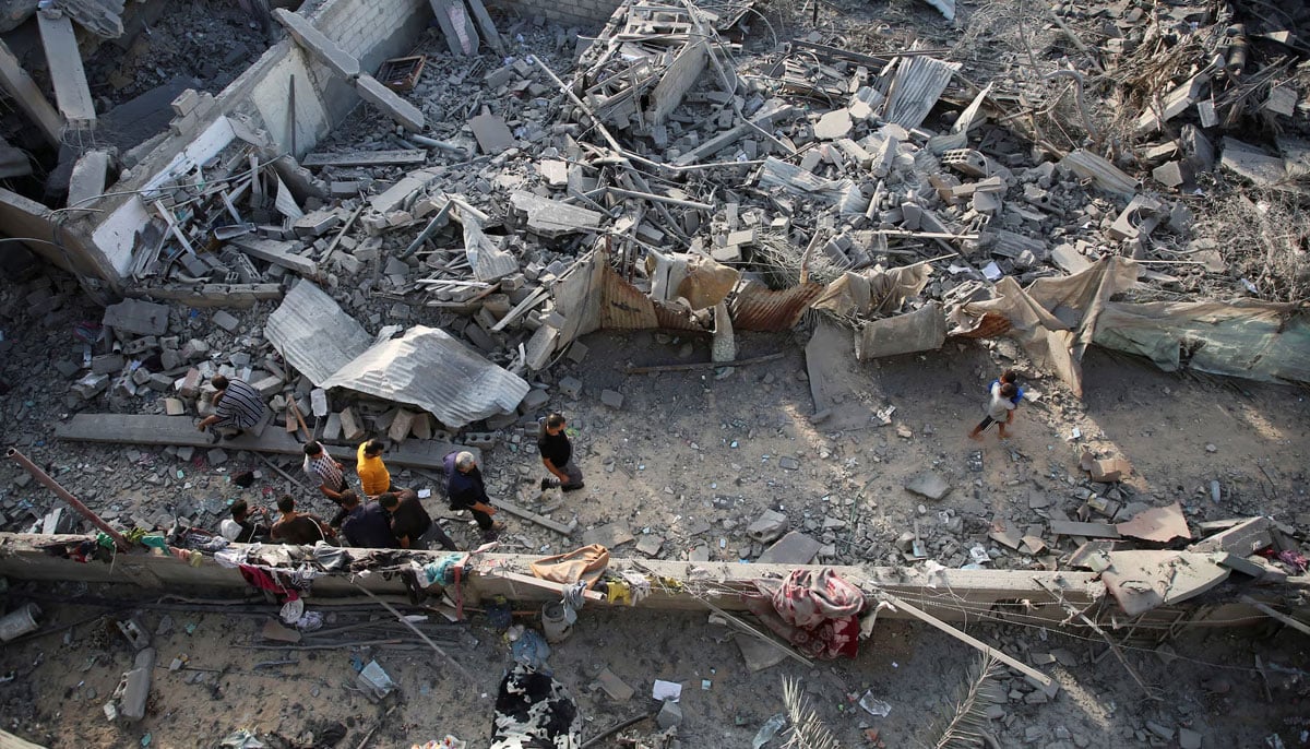 Palestinians inspect the site of Israeli strikes in Khan Younis in the southern Gaza Strip this October. — Reuters/File