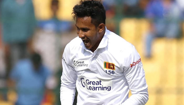 Praveen Jayawickrama celebrates after grabbing a wicket in a Test against India on March 12, 2022 in Bengaluru, India. — BCCI