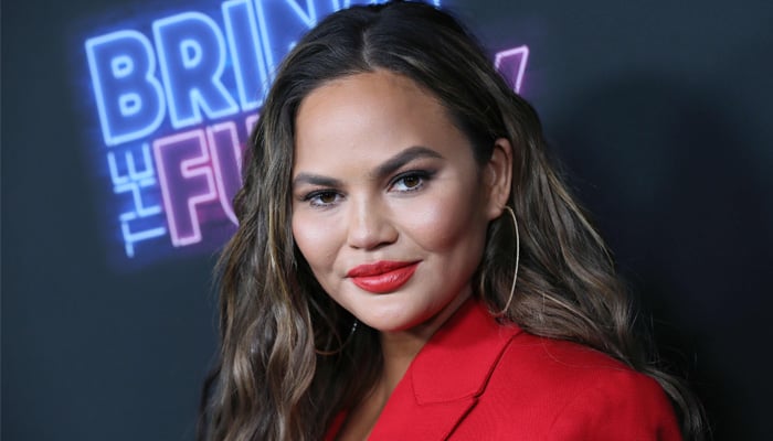 Chrissy Teigen shares sneak-peek into family shoot day