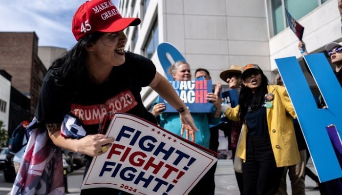 Republican and Democratic supporters confront each other outside of the CBS Broadcast Centre prior to the Vice President candidates Tim Walz and JD Vance debate in Manhattan in New York City, US, October 1, 2024. — Reuters