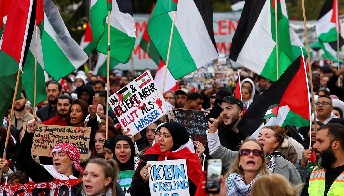 Protesters hold placards and Palestinian flags during a demonstration in solidarity with Palestinians in Gaza, ahead of the October 7 attack anniversary, amid the Israel-Hamas conflict, in Berlin, Germany, October 5, 2024. — Reuters