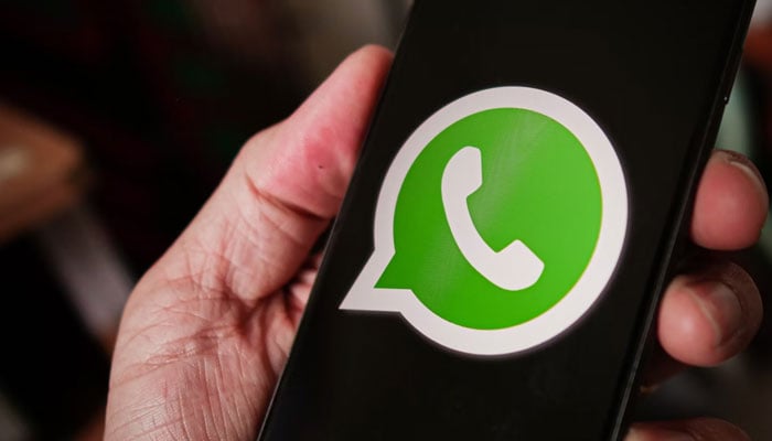 A representational picture showing the WhatsApp logo displayed on a phone screen. — Unsplash