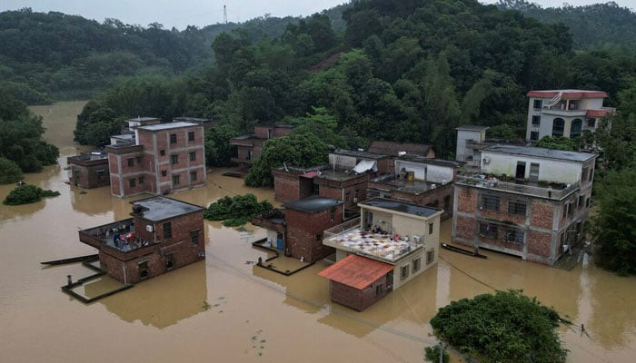 A drone view shows houses submerged in floodwaters following heavy rainfall, at a village in Qingyuan, Guangdong province, China April 22, 2024. — Reuters