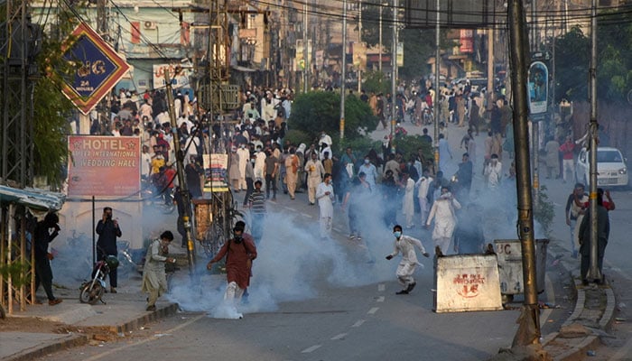 Pakistan Tehreek-e-Insaf supporters gather for a rally as tear gas is used by police officers to disperse them, in Rawalpindi, September 28, 2024. — Reuters