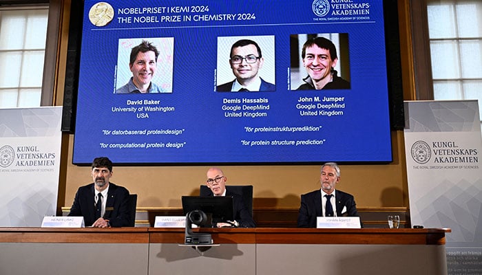 Announcers of the laureates for the Nobel Prize in Chemistry, Johan Aqvist, Hans Ellegren and Heiner Linke, look on as the images of the winners, David Baker, Demis Hassabis and John M Jumper are displayed, in Stockholm, Sweden October 9, 2024. — Reuters