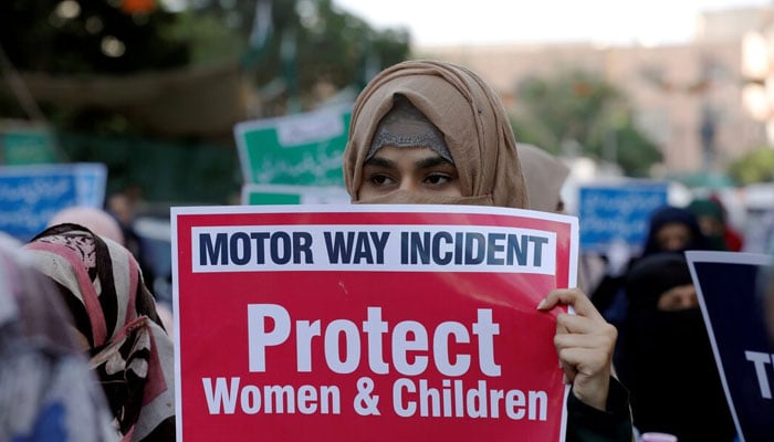 A woman carries a sign against a gang rape that occurred along a highway, and to condemn the violence against women and girls, during a demonstration in Karachi, Pakistan September 11, 2020. — Reuters