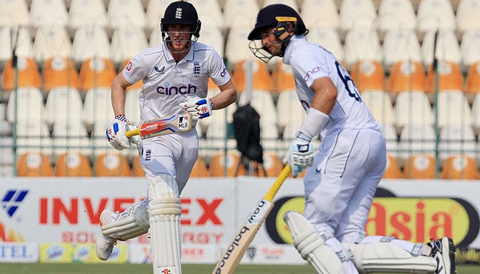 Englands Harry Brook and Joe Root in action as they run between the wickets on the third day of the first Test against Pakistan at Multan Cricket Stadium on October 9, 2024. — Reuters