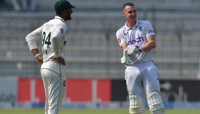 Pakistan skipper Shan Masood (left) reacts with Englands Harry Brook on the fourth day of the first Test in Multan Cricket Stadium. — PCB