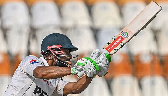 Pakistan’s captain Shan Masood plays a shot during the fourth day of the first Test cricket match between Pakistan and England at the Multan Cricket Stadium in Multan on October 10. — AFP