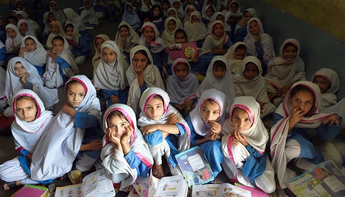 Girls attend a class in a school in Mingora, Swat. —AFP/File