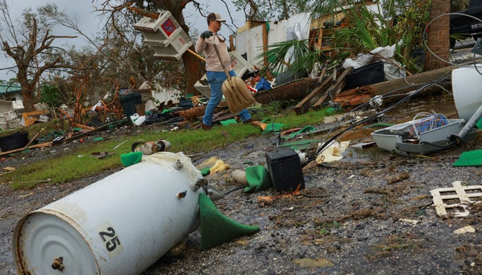 A resident walks next to his business which he lost during Hurricane Milton, in Lakewood Park, near Fort Pierce, in St Lucie County, Florida, US on October 11, 2024. — Reuters