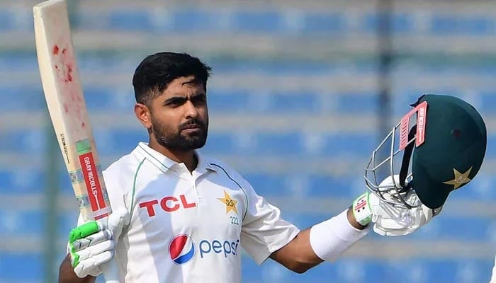 Pakistan former skipper Babar Azam gestures after scoring a century (100 runs) during the first day of the first cricket Test match between Pakistan and New Zealand at the National Stadium in Karachi on December 26, 2022. — AFP