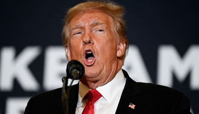 Former US president and Republican presidential candidate Donald Trump speaks during a Commit to Caucus event for his supporters in Coralville, Iowa, US, December 13, 2023 — Reuters.