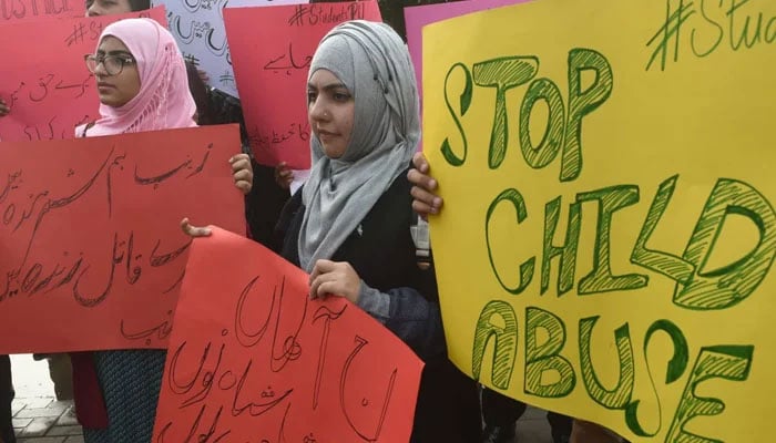 A woman carries a sign against a gang rape that occurred along a highway, and to condemn the violence against women and girls, during a demonstration in Karachi, Pakistan September 11, 2020. — Reuters