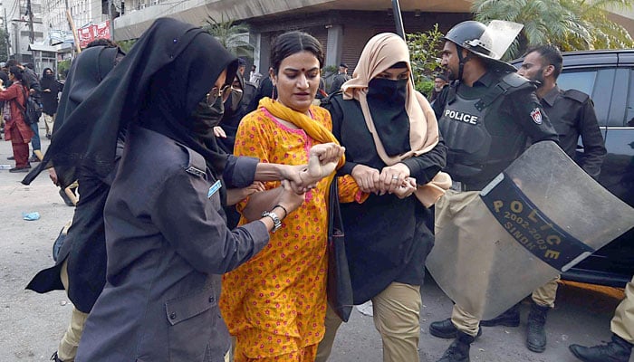 Police arrest a protester outside the Karachi Press Club (KPC) for violating Section 144 on October 13, 2024. — INP