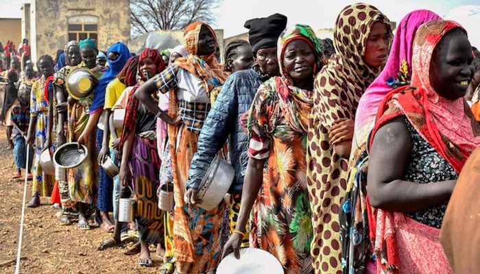 Women queue to receive food rations at the United Nations High Commissioner for Refugees (UNHCR) transit centre in Renk, near the border crossing point in Renk County of Upper Nile State. — Reuters/File