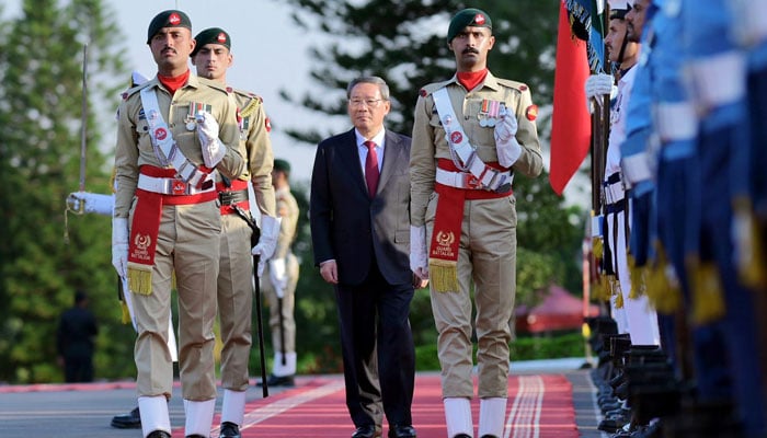 Premier Li receives a guard of honour during the official welcoming ceremony at Prime Minister’s House, Islamabad on October 14, 2024. — PID