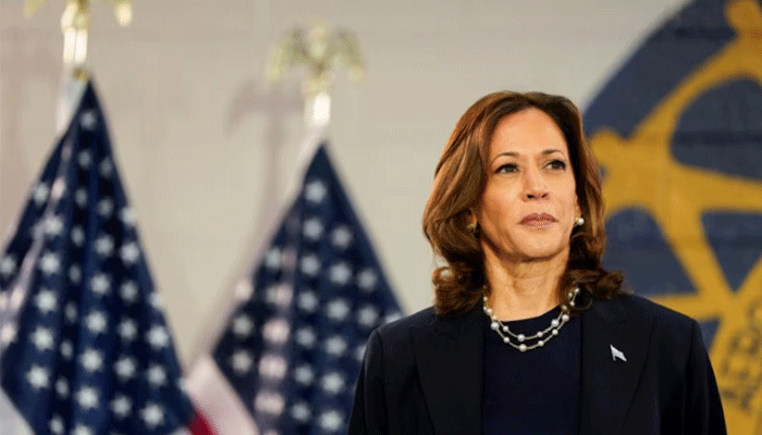 US Vice President and Democratic presidential candidate Kamala Harris looks on as she attends a campaign event with her vice presidential running mate Minnesota Governor Tim Walz August 8, 2024. — Reuters