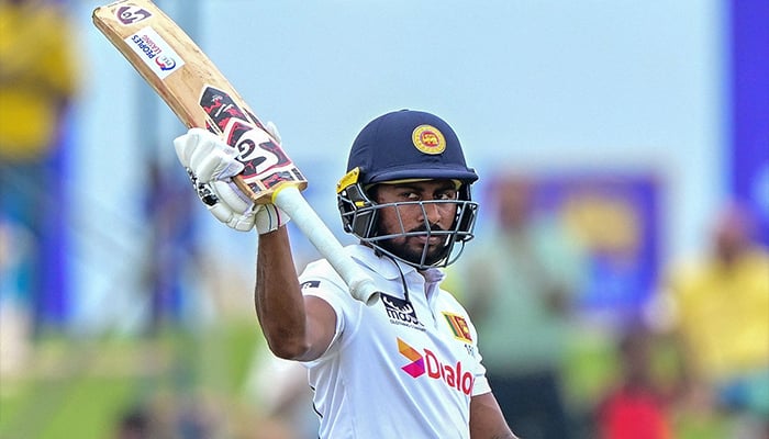 Sri Lankas Kamindu Mendis celebrates after scoring 150 runs during the second day of the second Test cricket match between Sri Lanka and New Zealand at the Galle International Cricket Stadium in Galle on September 27, 2024. — AFP