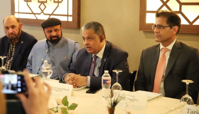 Pakistans Ambassador to the United States Rizwan Saeed Sheikh (centre) with the Pakistani diaspora leadership of Texas. —Pakistan Embassy in US/File