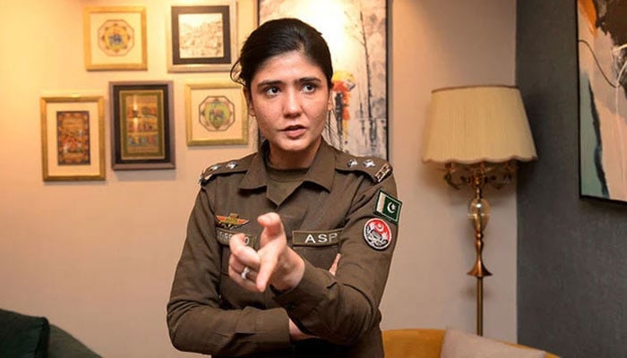 Defence ASP Shehrbano Naqvi gestures while talking during an interview. — AFP/File