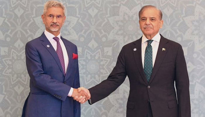 PM Shehbaz Sharif (right) shakes hands with Indian FM Subrahmanyam Jaishankar as the latter arrived at the Jinnah Convention Centre in Islamabad on October 16, 2024. — X/@DrSJaishankar