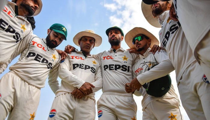 Pakistans players huddled together during Day 2 of the second Test match against England on Oct 16, 2024 at Multan Cricket Stadium. — PCB