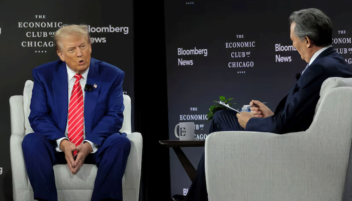 Republican presidential nominee and former US President Donald Trump is interviewed by Bloomberg Editor-in-Chief John Micklethwait at the Economic Club of Chicago in Chicago, Illinois, U.S. October 15, 2024. REUTERS