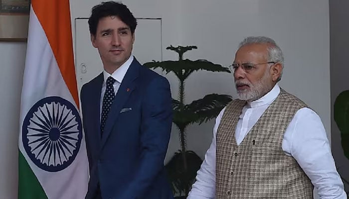 Canadian Prime Minister Justin Trudeau (L) and Prime Minister Narendra Modi arrive for a meeting at Hyderabad house in New Delhi.