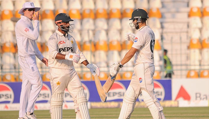 Pakistans Salman Ali Agha and Sajid Khan in action during day three of second Test between Pakistan and England at Multan Cricket Stadium on October 17, 2024. — PCB