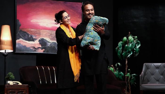 Plays director and actor Paras Masroor performs a scene with co-actor Sabreen Hisbani as his wife for theatre play Salgirah on October 17, 2024. — Facebook/Arts Council of Pakistan Karachi