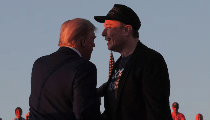 Tesla CEO and X owner Elon Musk poses with Republican presidential candidate former US President Donald Trump on October 5, 2024. – Reuters