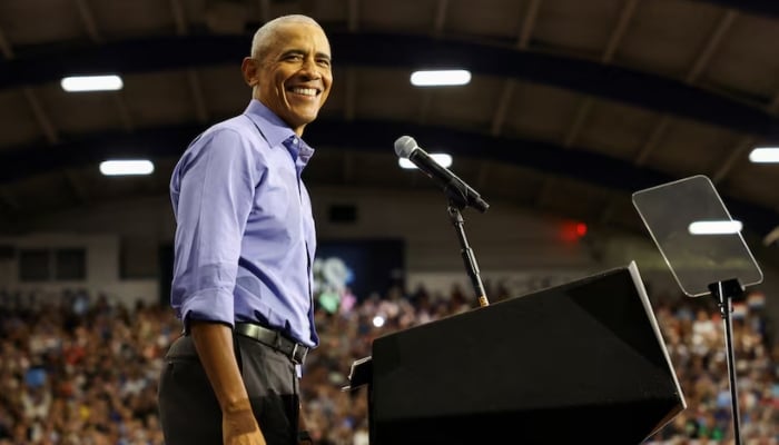 Former U.S. President Barack Obama reacts during a campaign event in support of Democratic presidential nominee and U.S. Vice President Kamala Harris, Pennsylvania, US, October 10, 2024. REUTERS