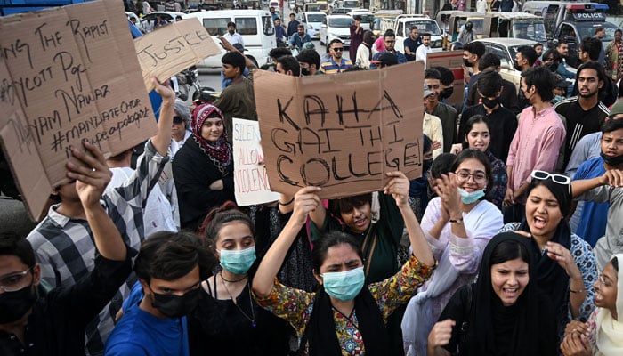 Protesters holding placards take part in a demonstration to condemn the alleged rape of a female student, in Karachi on October 18, 2024. — AFP