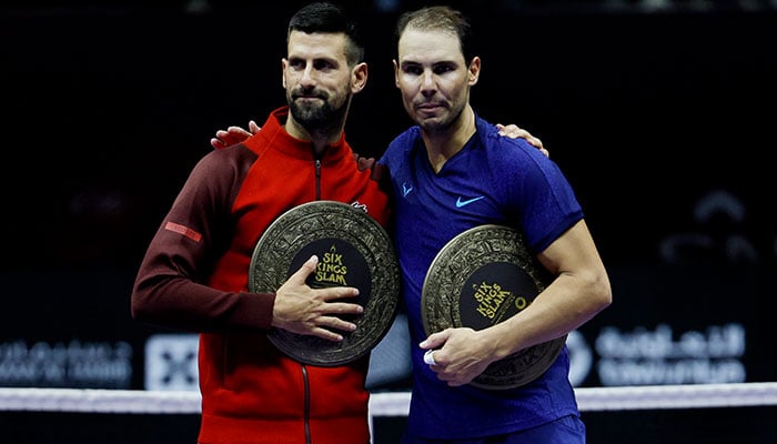 Serbias Novak Djokovic (left) and Spanish Spains Rafael Nadal pose after their third place match in the Six Kings Slam tournament in Riyadh, Saudi Arabia on October 19, 2024. — Reuters